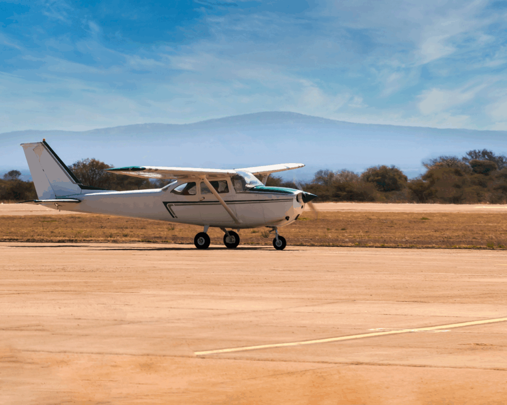 Sustainable Safaris Africa - Experiences - Fly-in Safaris Thumbnail - Small Aircraft Taking off on Gravel Runway