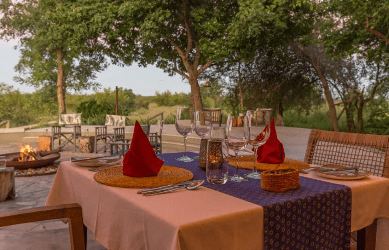 S002-IT1 - Set Dining Tables at Sunset Sustainable Safaris Africa - Journeys - Luxury Kruger Safari - Set Dining Tables at Sunset
