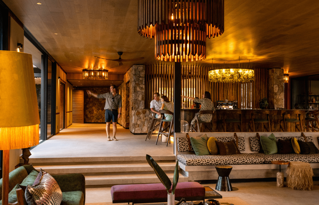 S002-IT2 - Guests Sitting at Lounge and Sitting Area Sustainable Safaris Africa - Journeys - Luxury Kruger Safari - Guests Sitting at Lounge and Sitting Area