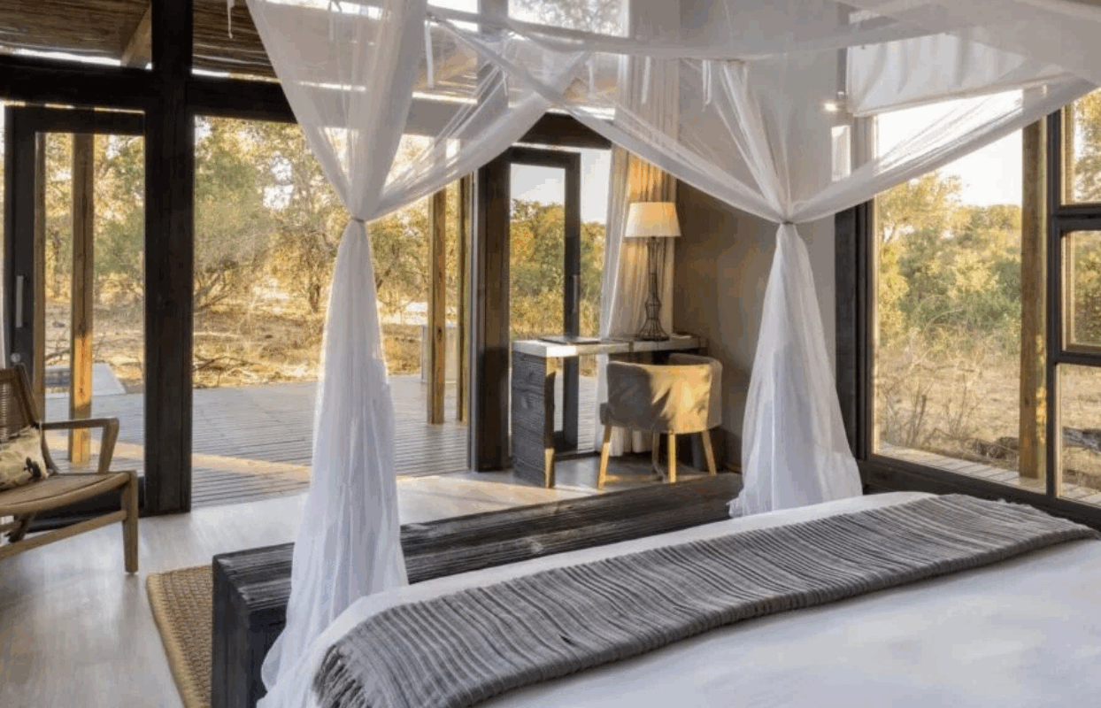 S003-IT2 - Double Bed and Mosquito Net at Accommodation Sustainable Safaris Africa - Journeys - Family Friendly Kruger Safari - Double Bed and Mosquito Net at Accommodation