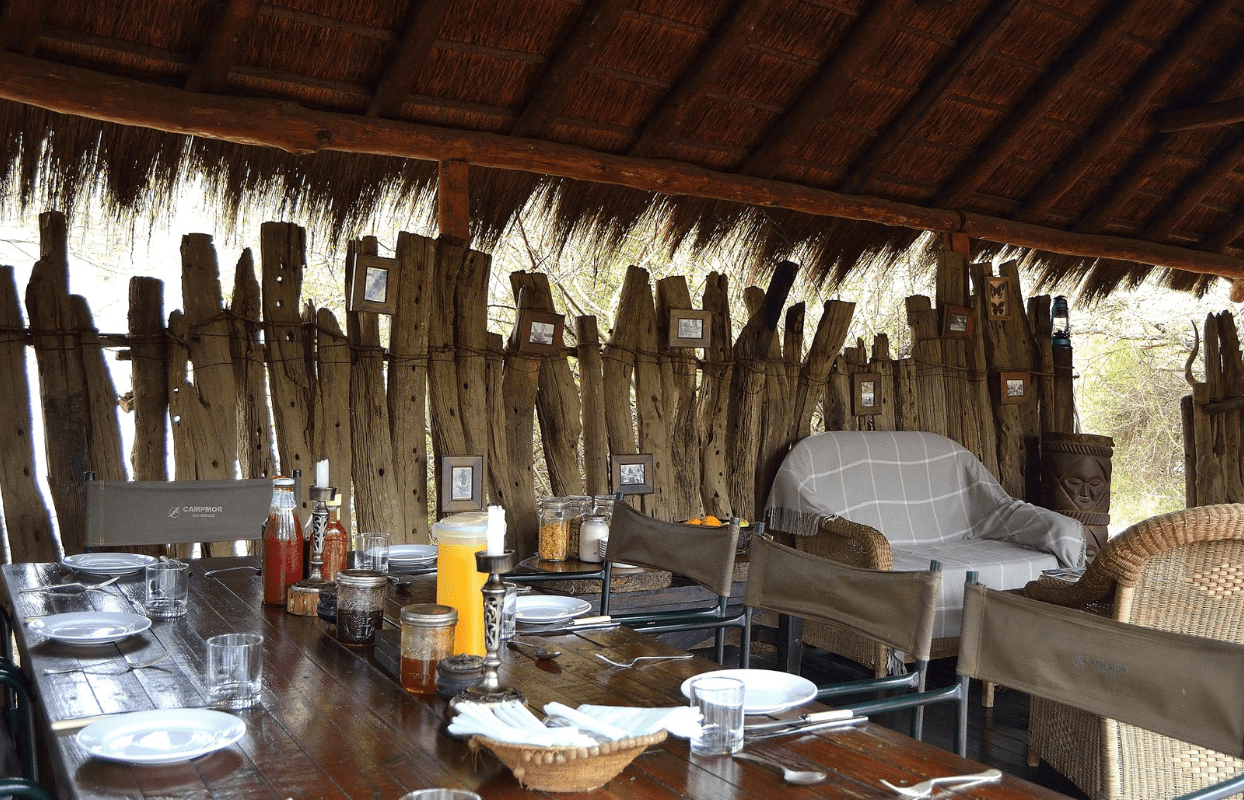 S004 - IT2 - Set Dining Table and Chairs in Safari Cabin Sustainable Safaris Africa - Journeys - African Glamping Safari - Set Dining Table and Chairs in Safari Cabin